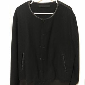 Black scale jacket, wide collar, leather back.